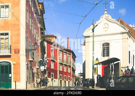 Lisbon - Portugal, December 25, 2018 : Street perspective view with colorful traditional houses in Alfama district, Lisbon, Portugal Stock Photo
