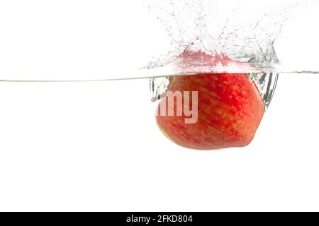 ripe red apple and clear water splash isolated on white Stock Photo
