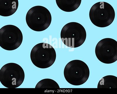 Vinyl records multiplied on soft blue background. Minimal abstract retro and vintage music concept. Retro technology idea. Stock Photo