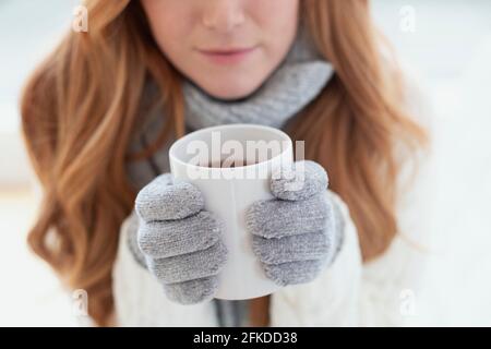 Woman holding a hot drink Stock Photo