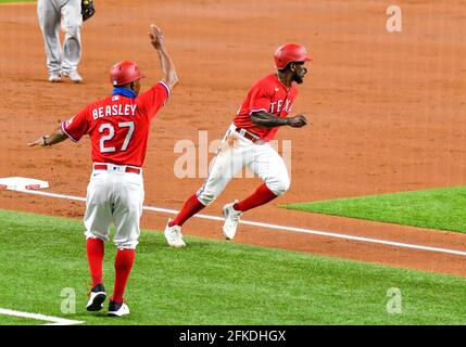 Texas Rangers' Adolis Garcia, bottom center, is hugged by Jose Trevino, top  center, as Isiah Kiner-Falefa, left, and Joey Gallo, right, join in after a  walk-off single against the Houston Astros in