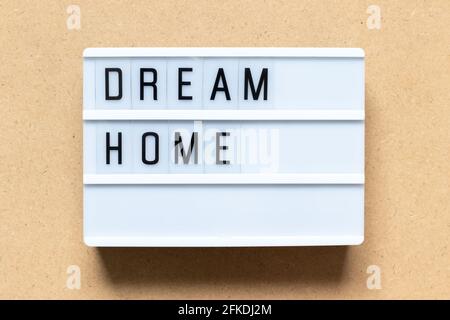 White lightbox with word dream home on wood background Stock Photo