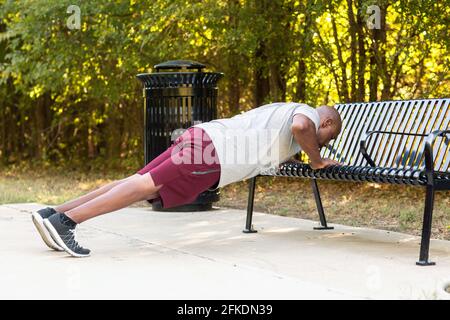 Mature African American working out and doing push ups. Stock Photo