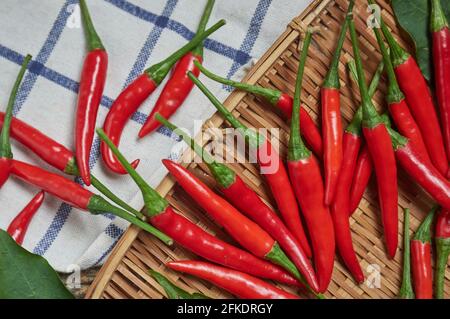 The red chili peppers and the bamboo tray Stock Photo