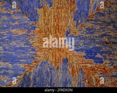 Ceiling with an old blue paint flaking off and revealing its structure of red bricks. Villefranche-sur-Mer, French Riviera, France. Stock Photo