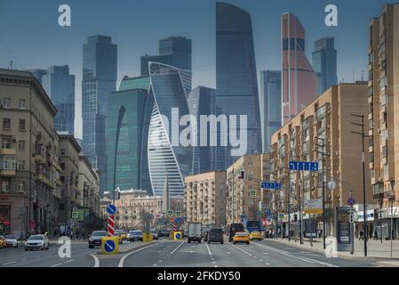 MOSCOW, RUSSIA - APRIL 14, 2021: View of Bolshaya Dorogomilovskaya Street against the backdrop of the Moscow-City International Business Center on a A Stock Photo