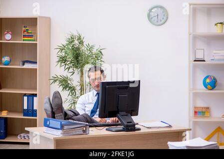 Young employee sitting in the office Stock Photo