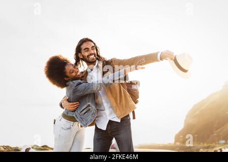 Happy smiling couple having fun dating outdoor - Youth people love and relationship concept Stock Photo