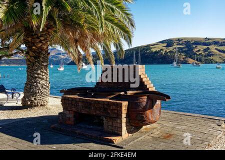 Relics from Akaroa's whaling past on the seafront. Akaroa, Christchurch, Canterbury, New Zealand. Stock Photo