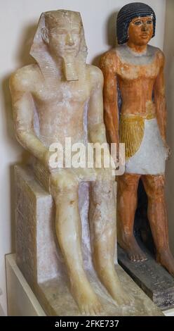 Cairo, Egyptian Museum, statue of king Khephren, egyptian alabaster, from Memphis. He's seated, wears a nemes with an uraeus. Stock Photo