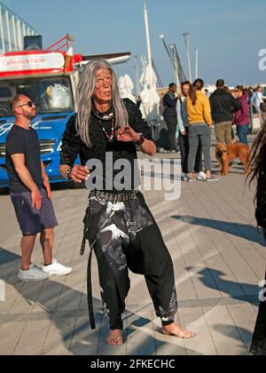 Dancing on a sunny day close to the beach at Brighton Stock Photo