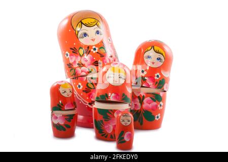 wooden souvenir dolls isolated on a white backgroud Stock Photo