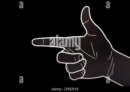 pointing hand left isolated on a black background Stock Photo