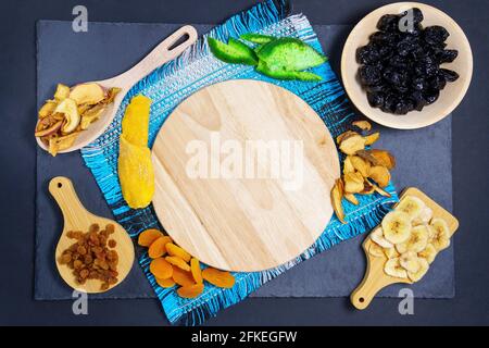 dried fruits on a background of wooden boards. The view from the top. Symbols of the Jewish holiday Tu Bishvat. thanksgiving day. Stock Photo