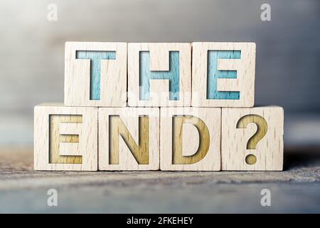 The End Written On Wooden Blocks On A Board Stock Photo