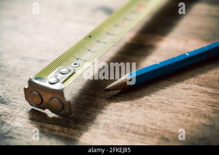 Pencil And Measuring Tape On An Vintage Wooden Table Stock Photo
