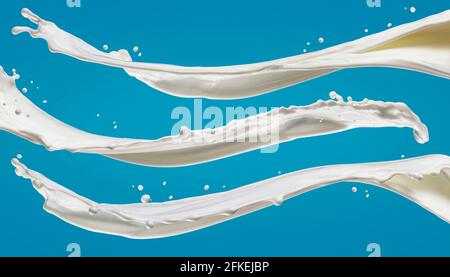 Milk splashes isolated on blue background Stock Photo