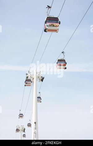 LONDON - MAY 26: Gondolas of the Emirates Air Line cable car, opened June 2012, run by TFL, links the Greenwich Peninsula with Royal Dock, 1km, across Stock Photo