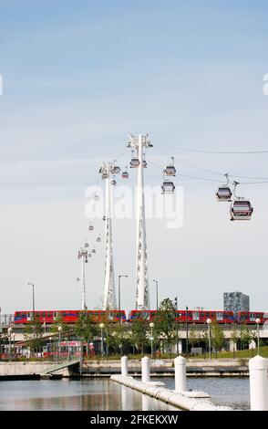 LONDON - MAY 26: Gondolas of the Emirates Air Line cable car, opened June 2012, run by TFL, links the Greenwich Peninsula with Royal Dock, 1km, across Stock Photo