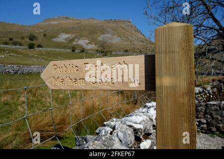 Wooden Public Footpath Signpost to Malham Cove from Gordale Scar in the Yorkshire Dales National Park, England, UK. Stock Photo