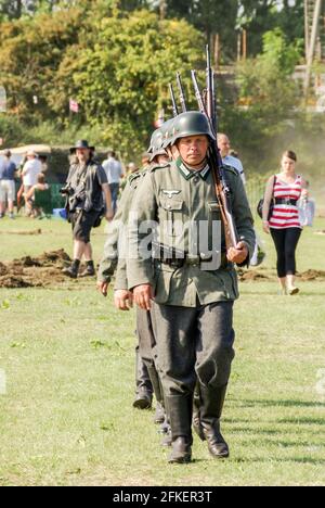 Re-enactors, re-enactment of Second World War German army soldiers marching. Drill. German Army (Wehrmacht) infantrymen. Uniform. Das Heer Living Soc. Stock Photo