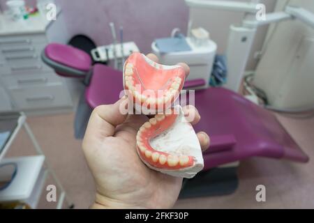 complete removable dental prostheses on gypsum models in the manufacturing process Stock Photo