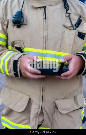 firefighter operating drone in search and rescue Stock Photo - Alamy
