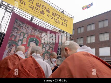 Seoul, South Korea. 27th Apr, 2021. South Korean Buddhist nuns perform a Buddhist ritual against the military of Myanmar in front of the Myanmar embassy in Seoul.Representatives of the Korean Bhiksuni Association and Buddhist women held prayer meetings for the pro-democracy people of Myanmar and demanded the military of Myanmar to stop all acts of armed repression against the people. They also asked all state members of the United Nations to take action for peace and security in Myanmar. Credit: SOPA Images Limited/Alamy Live News