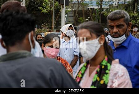 Mumbai, India. 01st May, 2021. People wearing face mask wait in a queue to enter Bandra Kurla Complex (BKC) vaccination center in Mumbai. Vaccination drive for 18-44 years age group started on 1st May 2021. only those people who were eligible for the vaccine received confirmation about their registration on the phone. (Photo by Ashish Vaishnav/SOPA Images/Sipa USA) Credit: Sipa USA/Alamy Live News Stock Photo