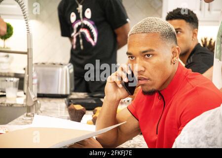 Lake Forest, USA. 01st May, 2021. German-American football player Amon-Ra St. Brown talks on the phone with Detroit Lions officials. The team selected the 21-year-old 112th overall in the draft. Credit: Maximilian Haupt/dpa/Alamy Live News Stock Photo