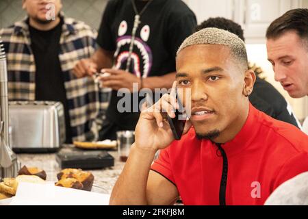 Lake Forest, USA. 01st May, 2021. German-American football player Amon-Ra St. Brown talks on the phone with Detroit Lions officials. The team selected the 21-year-old 112th overall in the draft. Credit: Maximilian Haupt/dpa/Alamy Live News Stock Photo