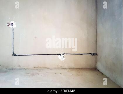 Wiring. Sockets and wires in the wall - room repair - interior design Stock Photo