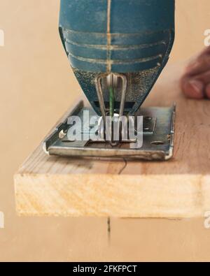 Sawing wood by hand worker Stock Photo