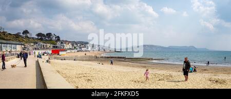 Panoramic view of Lyme Regis beach and seafront in Lyme Regis, Dorset, UK on 21 April 2021 Stock Photo