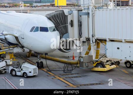 Jet engine against a middle size plane at the airport on loading ...