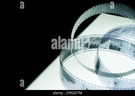 Analog black and white 35mm negative film strip on light table Stock Photo