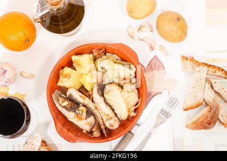 Typical portuguese homemade ray fish with potatos and garlic and olive oil. Stock Photo