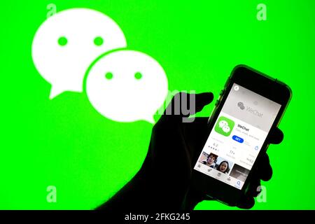 Barcelona, Catalonia, Spain. 30th Apr, 2021. In this photo illustration, the WeChat app in App Store seen displayed on a smartphone screen and a WeChat logo in the background. Credit: Thiago Prudencio/DAX/ZUMA Wire/Alamy Live News Stock Photo