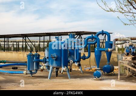 Water and moss tanks used in garden irrigation, irrigation system engine Stock Photo