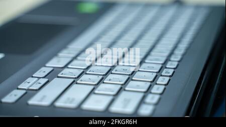 close up shot of laptop keyboard. working Stock Photo