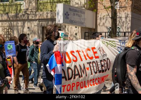 Chicago, IL, USA. 1st May, 2021. Protestors demanding justice for 13 year-old Adam Toledo, who was shot by a Chicago police officer, during an annual protest in support of labor rights known as, ''May Day'' in the United States, May 1, 2021. Credit: Dominic Gwinn/ZUMA Wire/Alamy Live News Stock Photo
