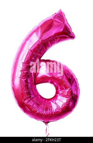 Foil balloon number 6 isolated on white background, pink numeral Six made as inflatable balloon number for party. Shiny metallic flying figure 6 for b Stock Photo