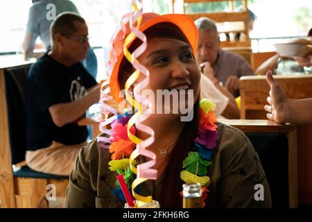 Medellin, Colombia - March 28 2021: Fat Adult Latin Woman Celebrating her Birthday in a Restaurant Stock Photo