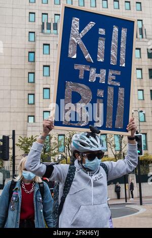 A protester holds a placard during a nationwide protest against rising ...