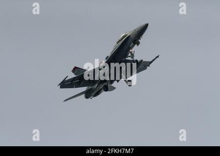 A McDonnell Douglas F/A-18D Hornet with the Marine Fighter Attack Squadron 232 (VMFA-232) known as The Red Devils flying near NAF Atsugi airbase. Japan Stock Photo