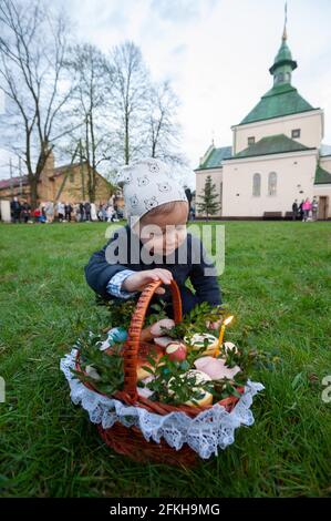 Lviv, Ukraine. 01st May, 2021. Little boy with an Easter basket at a Greek Catholic Church as they celebrate Easter to mark the resurrection of Jesus Christ from the dead and the foundation of the Christian faith. (Photo by Mykola Tys/SOPA Images/Sipa USA) Credit: Sipa USA/Alamy Live News Stock Photo