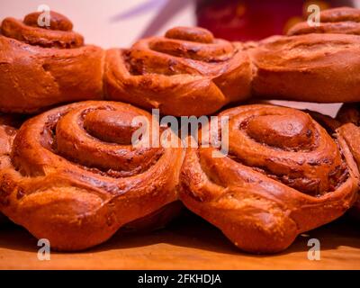 Sweet pastry rolls filled with chocolate pudding - commonly called as snails - folded on each other Stock Photo