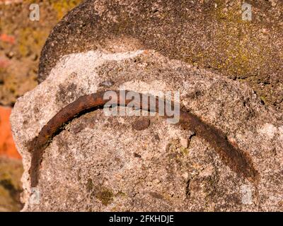 Old rusty iron reinforcement in concrete Stock Photo