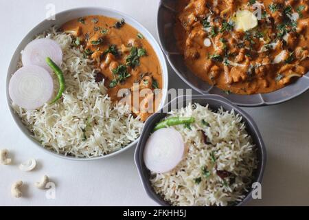 Cumin flavoured basmati rice served along with roasted cauliflower prepared with tomato and cashew sauce. Popular meal combination from north India Stock Photo