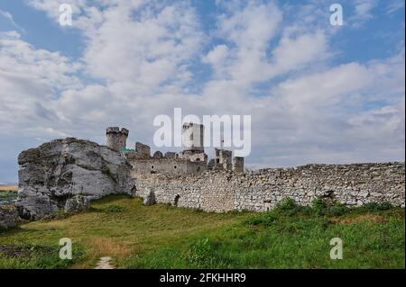 Castle on the hill surrounded by a wall and rocks Stock Photo